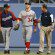 Bryce Harper is helped off the field after running into the outfield wall.