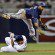 Jean Segura leaps over a sliding runner to complete a double play.