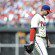 Roy Halladay walks off the mound with his head down.