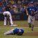 J.A. Happ lies on the ground while a teammate runs to attend to him.
