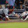 Jordan Schafer slides headfirst safely into home.