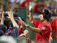 Anthony Rendon is congratulated in the dugout.