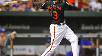 Manny Machado watches the flight of the ball after getting a hit.
