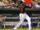 Manny Machado watches the flight of the ball after getting a hit.