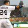 Miguel Cabrera standing on the field and pointing toward first.
