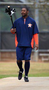 Image of Chris Carter carrying a bat at Houston Astros spring training camp.