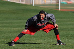 MLB prospect Billy Hamilton stretches in the outfield.