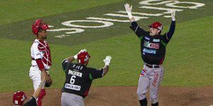 Doug Clark approaches home plate after his home run gave Mexico the Caribbean Series title.
