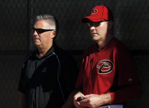 Arizona GM Kevin Towers and manager Kirk Gibson standing in shadows.