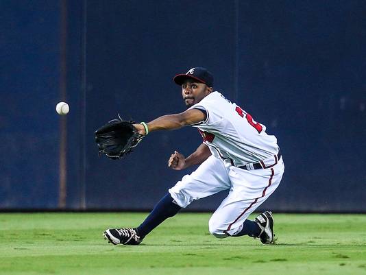 Michael Bourn tracks down a fly ball in the outfield.