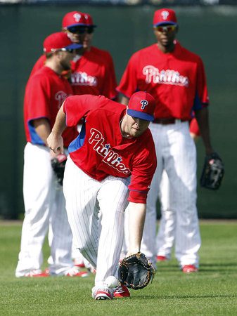 Darin Ruf fields a ground ball in the outfield during spring training drills.