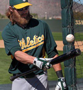 Oakland Athletics outfielder Josh Reddick bounces a ball on his bat during batting practice in spring training.