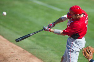 Cincinnati Reds star Joey Votto swinging a bat.