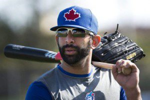 Toronto Blue Jays star Jose Bautista carries his bat and glove during spring training.