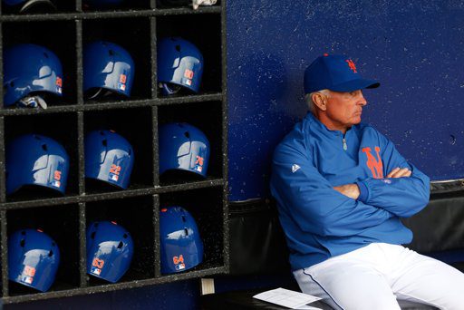 New York Mets manager Terry Collins sits alone in the dugout.