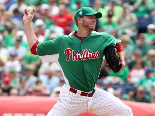 Roy Halladay delivers a pitch during his St. Patrick's Day start in spring training.