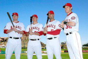 Los Angeles Angels hitters pose for pictures in spring training.