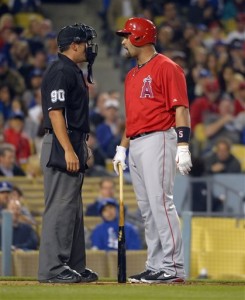 Los Angeles Angels Albert Pujols talks to an umpire.