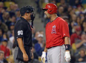 Los Angeles Angels Albert Pujols talks to an umpire.