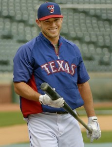 Texas Rangers Ian Kinsler wraps up batting practice with a smile.
