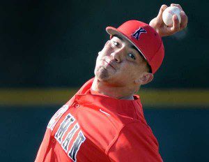 2013 MLB draft prospect Carlos Salazar throws a pitch.