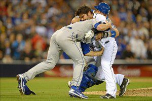 Carlos Quentin charges Zack Greinke.