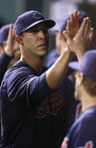 Ubaldo Jimenez gets high fives in the dugout from teammates after last night's win.