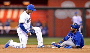 Jose Reyes grabs his ankle after sliding into second base.