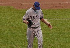 Texas Rangers pitcher Alexi Ogando leaves the game in disgust.