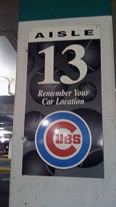 Chicago Cubs logo on an airport parking garage airport is labeled row "13".