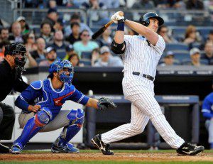 Travis Hafner swings and gets a hit for the New York Yankees.