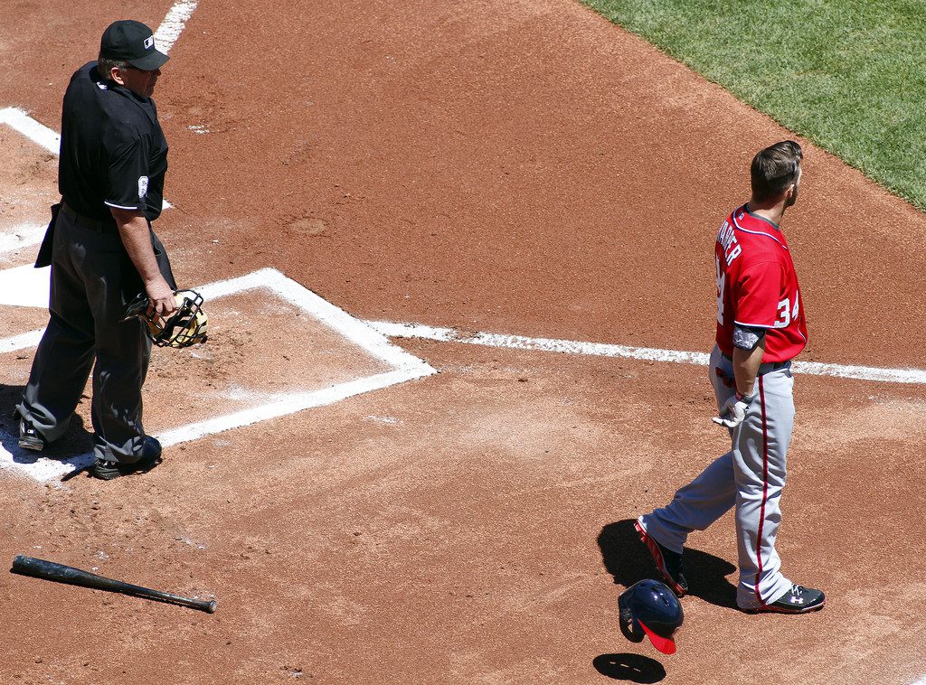 Bryce Harper walks away from home plate after a check-swing was called a strike.