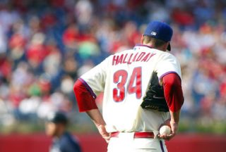 Philadelphia Phillies pitcher Roy Halladay walks around the mound on Sunday.