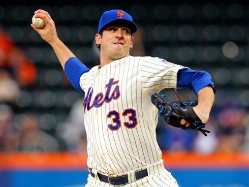 Matt Harvey has a trickle of blood coming out of his nose as he gets ready to deliver a pitch.