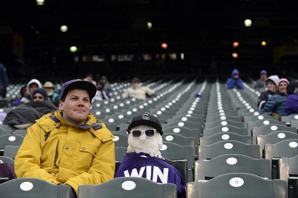 Fan sits in freezing cold, mostly empty Coors Field.