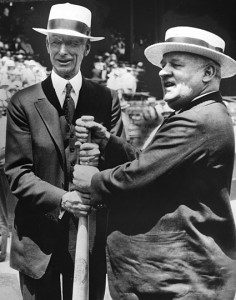 Connie Mack and John McGraw, managers of the the first MLB All-Star Game, hold a bat together in pre-game festivities.