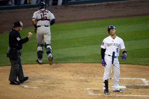 Colorado Rockies Carlos Gonzalez stands at home plate after striking out.