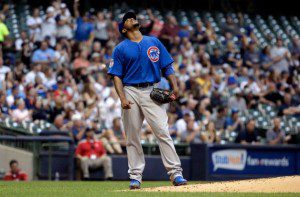 Chicago Cubs pitcher Edwin Jackson stands on the mound looking to the sky.