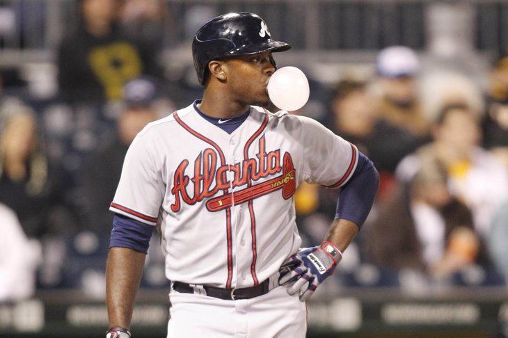 Justin Upton blows a bubble while standing at home plate.