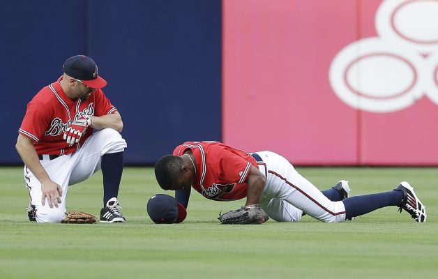 Atlanta Braves players hurt in the outfield.