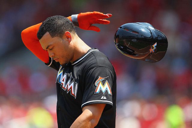Giancarlo Stanton flips his helmet off in disgust. Miami Marlins are approaching a record for run-scoring futility the Chicago Cubs would be more than happy to give up.