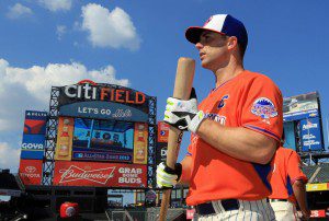 New York Mets 3B David Wright holds a bat with the Citi Field scoreboard in the background 
