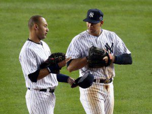 New York Yankees Derek Jeter and Alex Rodriguez chat on the field.
