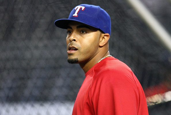 Nelson Cruz standing by the batting cage.