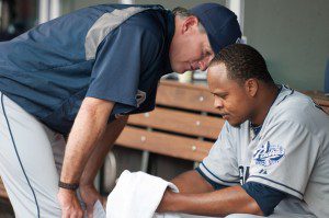 Edinson Volquez gets a talk from manager Bud Black in the dugout. 