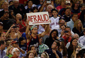  A fan at Fenway Park holds up a sign that says "A-Fraud" when Alex Rodriguez was at-bat. They also chanted "Derek Cheater" instead of Derek Jeter.