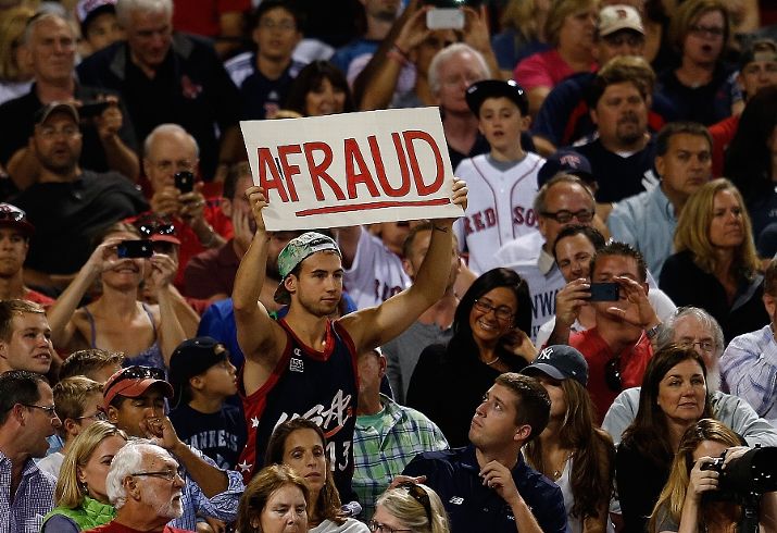 A fan at Fenway Park holds up a sign that says "A-Fraud" when Alex Rodriguez was at-bat.
